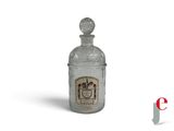 a glass bottle with a picture of a man on it