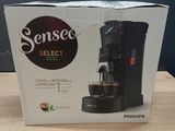 packaging of a coffee maker sitting on top of a wooden table