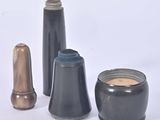 three different types of vases sitting on a white surface