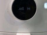 a white air fryer with the word jell m written on it