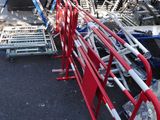 a lot of red and white chairs in a parking lot