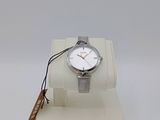 an image of a watch on a display stand with a tag on it