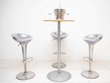 three stools and a table in a room