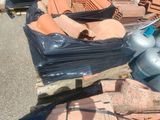 many piles of roof tiles on a pallet