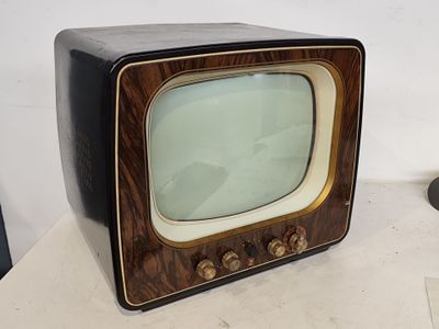 an old television sitting on top of a table