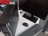 a desktop computer sitting on a desk with a keyboard and mouse