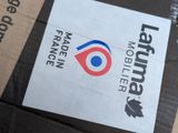 a box with a sticker on it sitting on the ground