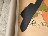a drawing of a woman wearing a hat on a piece of paper