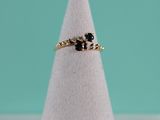 a close up of a ring on a white cone on a table