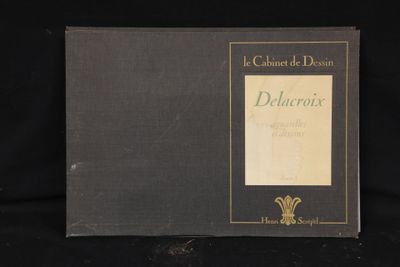 a black book with gold lettering on it sitting on a black surface
