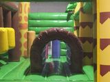 a inflatable bouncer with a jungle theme inside of it