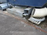 a boat that is sitting on the side of the road