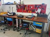 a workbench with tools on it in a garage