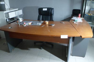 a desk with a computer and a printer on it
