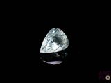 a close up of a diamond on a black surface