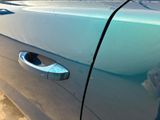 a close up of a blue car door handle