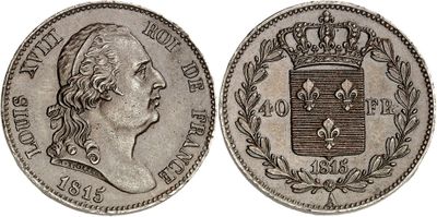 a silver coin with a crown on top of it