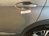 a close up of a car door handle with a sticker on it