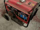 an image of a small generator in a garage