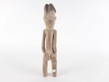 a small wooden statue of a man with a hat on his head