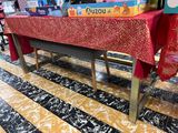 a table that has a red table cloth on it