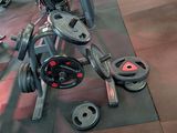 an image of a gym room with weights and equipment