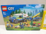 a box of lego city police vehicles on the table