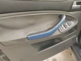 a car door handle with a blue handle on it