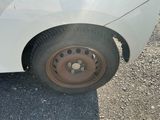 a white car that has a flat tire on it