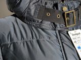 an image of a jacket with a tag attached to it
