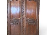 an old wooden armoire with carvings and carvings on the doors
