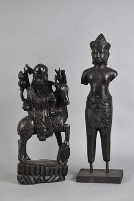 pair of bronze figurines of a woman and a man on a horse