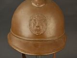 an old helmet with a lion head on it on a metal stand