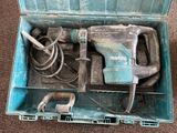 a blue tool box with a hammer and other tools in it