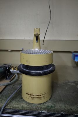 a yellow and black machine sitting on top of a table