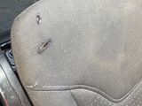 the seat of a car with a hole in the middle of it