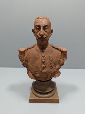 an old bust of a man with a mustache on top of a table