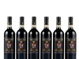 four bottles of red wine are lined up on a white surface