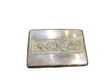 a close up of a silver money clip on a white background