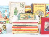 several children ' s books stacked on top of each other on a white surface