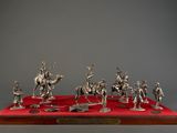 silver figurine of a group of people on horseback