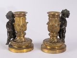 pair of antique bronze candlesticks with cherenshes and cherenshes