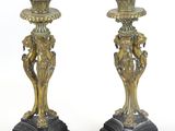 pair of antique brass candlesticks on black marble bases