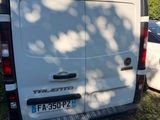 a white van that is parked in the grass