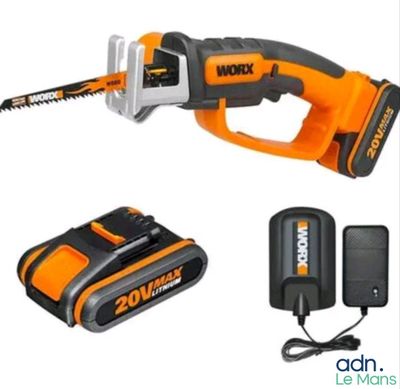 a corded saw with a battery and charger on a white background