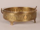 an antique brass bowl with handles and handles on a stand