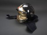 black and gold helmet on a black scarf on a gray background