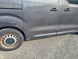 an image of a van with a flat tire on the road