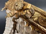 a gold colored object with crystals on a table