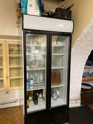 a refrigerator that has two bottles of beer in it